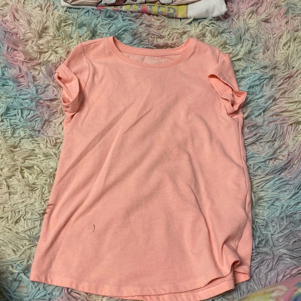 I am selling a pink 7/8 kids T-shirt short sleeve.